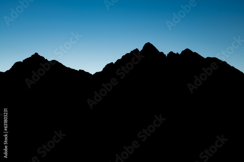 Tatra mountains at the border of Poland and Slovakia are silhouetted against the evening sky
