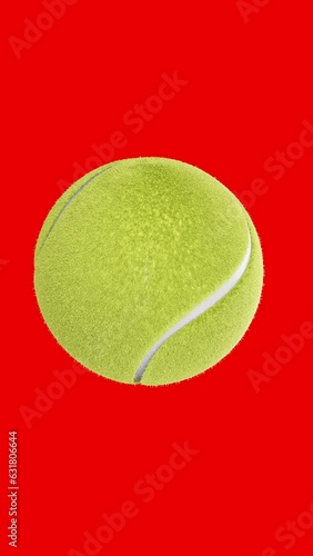 Vertical tennis ball on green 4k