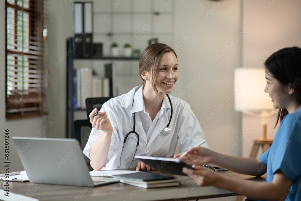 female doctor consulting with a female nurse at the clinic at the hospital female doctor consulting with a female nurse at the clinic at the hospital