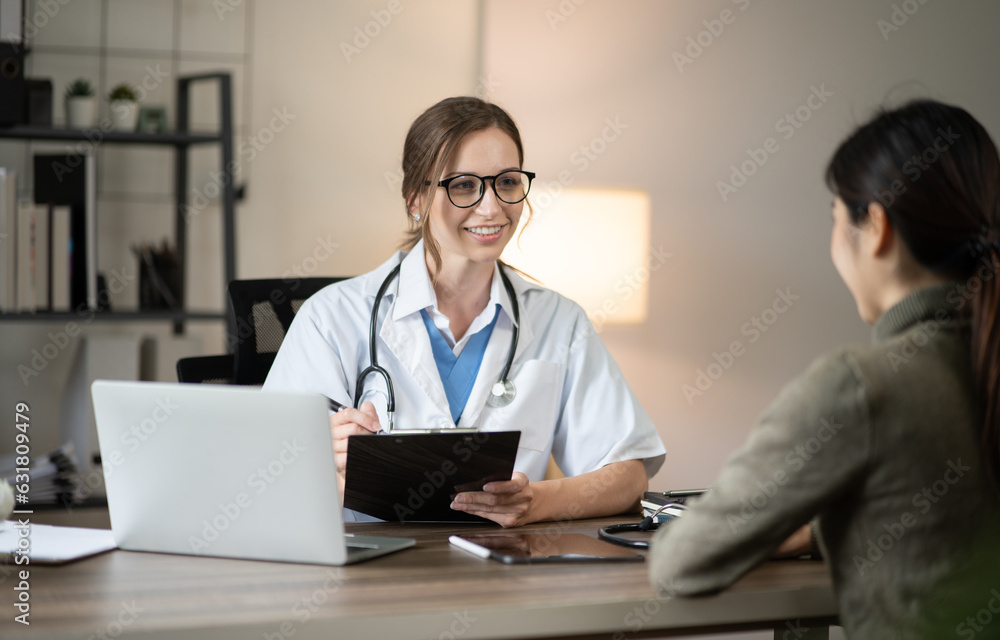 female doctor consulting with a female nurse at the clinic at the hospital female doctor consulting with a female nurse at the clinic at the hospital