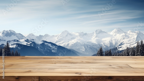 Empty wooden table with snow-capped winter mountains in the background, for display product