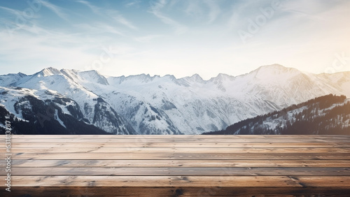 Empty wooden table with snow-capped winter mountains in the background, for display product