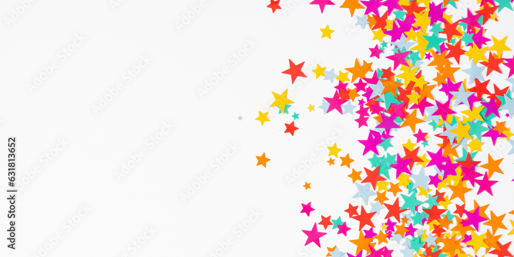 Festive background. Flat lay, top view of colorful  stars, stars on white background. Decoration party, birthday, anniversary, Christmas, New Year celebration concept.