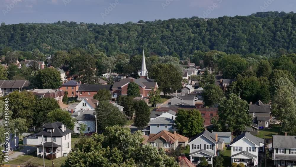 A rotating orbiting parallax view of a typical Pennsylvania residential neighborhood with a church steeple in the distance. Pittsburgh suburbs. A rotating orbiting parallax view of a typical Pennsylvania residential neighborhood with a church steeple in the distance. Pittsburgh suburbs.