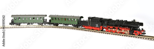 toy steam locomotive with wagons. model train isolated on white