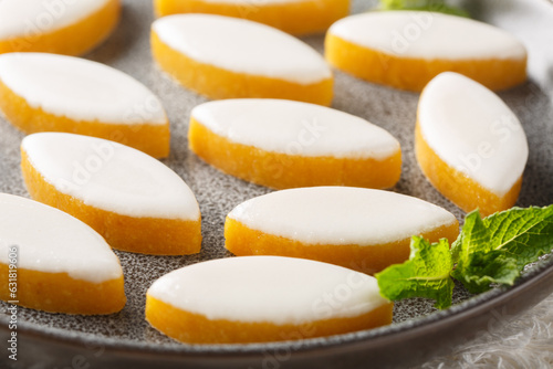 Traditional and expensive Provence sweets candy made of almonds and fruit Calissons closeup on the table. Horizontal