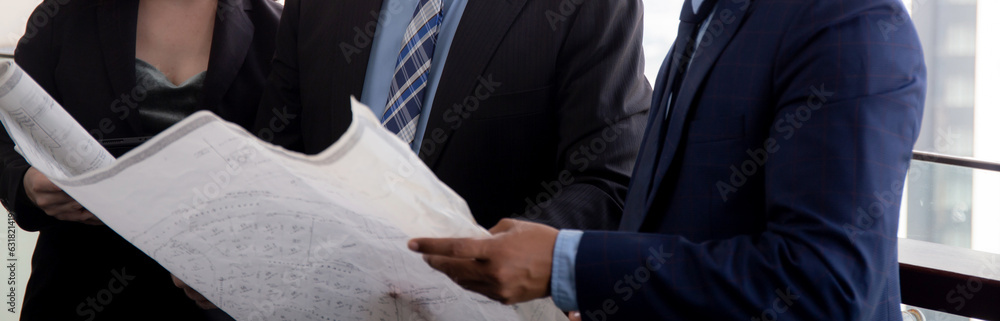 Obraz premium Senior architect and secretary inspector check blueprint and structure with contractor together at office, executive and supervisor or engineer planning project, industry and construction concept.