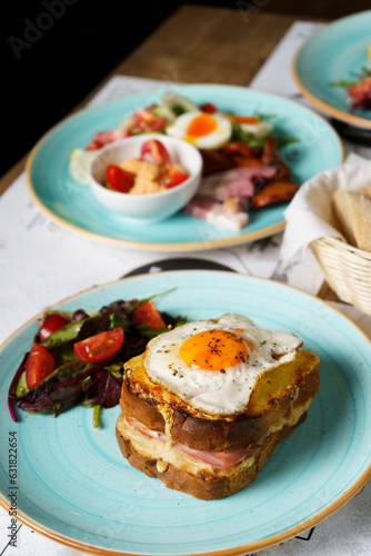 Classic french toast with cheese and ham, fried eggs, vegetables and honey-balsam dressing.