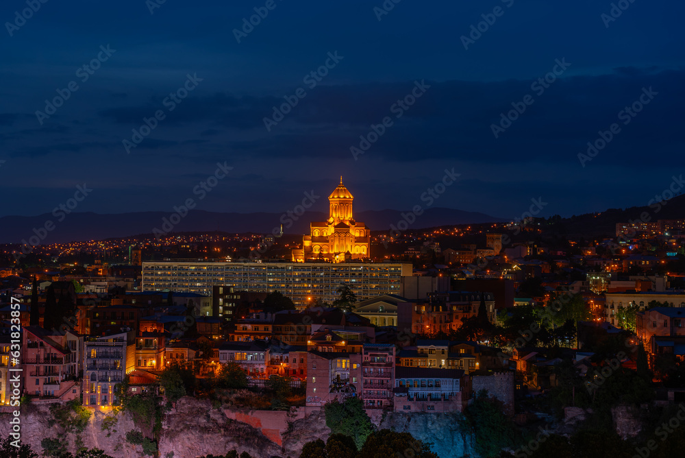 Holy Trinity Cathedral of Tbilisi and Cityscape of Georgia at Twilight