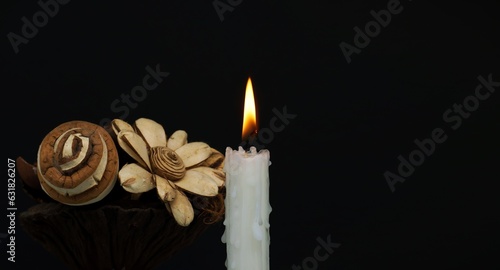 Close-up of a candle flame against a black background photo