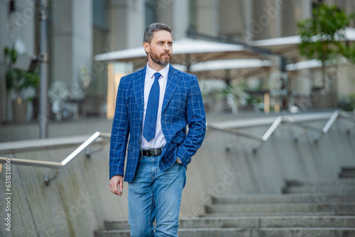 business man on urban background, advertisement. business man wearing jacket © be free