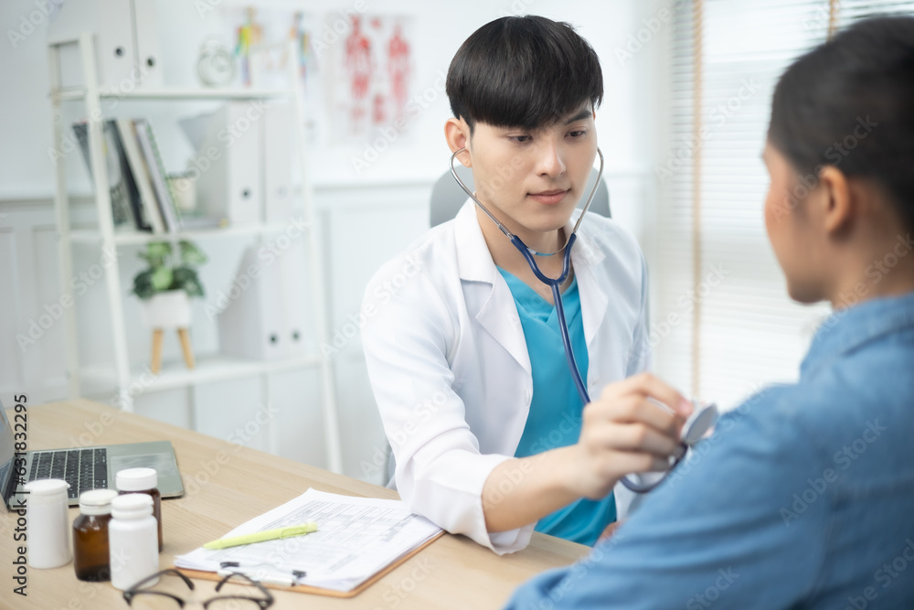 Asian young Doctor talking to woman patient at the clinic or hospital. Asian young Doctor talking to woman patient at the clinic or hospital.