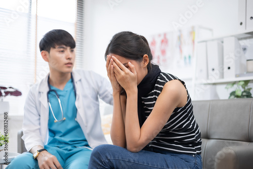 Asian young Doctor talking to woman patient at the clinic or hospital.