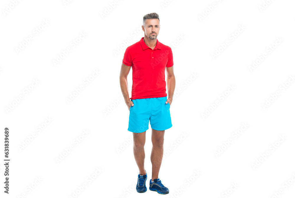 sportsman stands after working. sporty sportsman in sport clothes isolated on white. Sportsman wear sports uniform and looking at camera. athletic sportsman in working out over studio background
