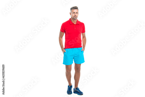 sportsman stands after working. sporty sportsman in sport clothes isolated on white. Sportsman wear sports uniform and looking at camera. athletic sportsman in working out over studio background