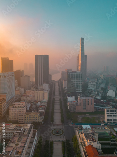 As dawn breaks over the vibrant city of Ho Chi Minh, Vietnam, an ethereal sight emerges amidst the morning mist and the iconic skyscrapers.