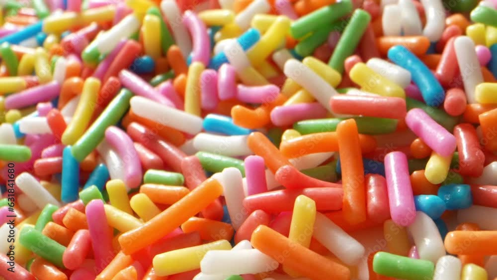 In a mesmerizing macro video, sugar sprinkles form a rainbow of brilliant blue hues, cascading like tiny crystalline waterfalls, evoking a delightful sense of wonder and sweetness.
In a mesmerizing macro video, sugar sprinkles form a rainbow of brilliant blue hues, cascading like tiny crystalline waterfalls, evoking a delightful sense of wonder and sweetness.