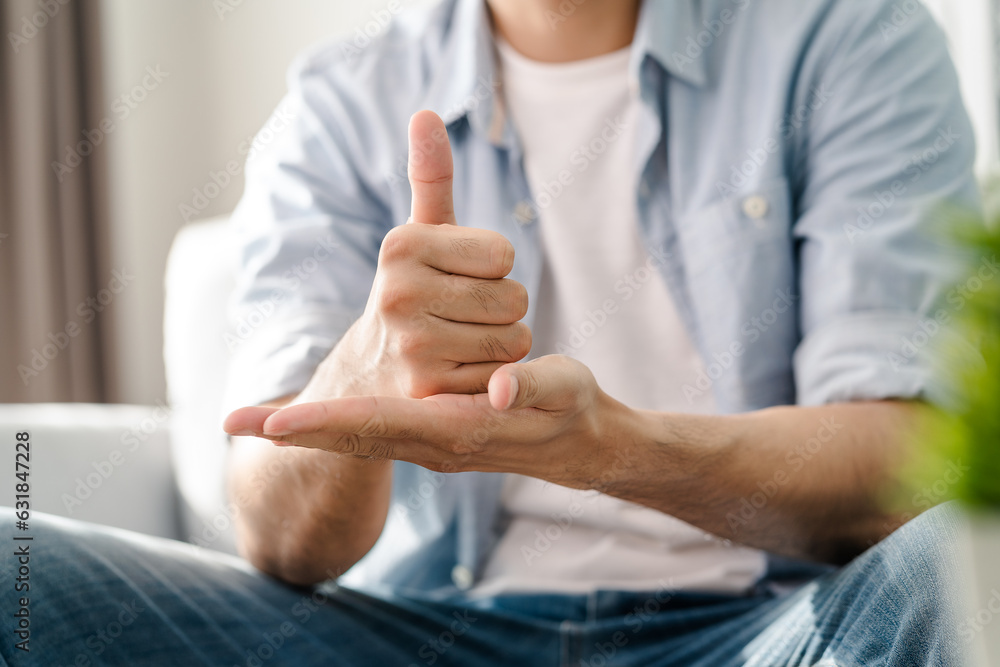 Happy young deaf man using sign Language to communicate with other people.. Happy young deaf man using sign Language to communicate with other people..