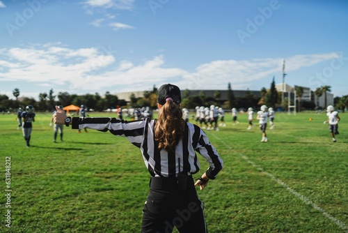 Konstfotografi Closeup of an American football referee standing on the field watching the game