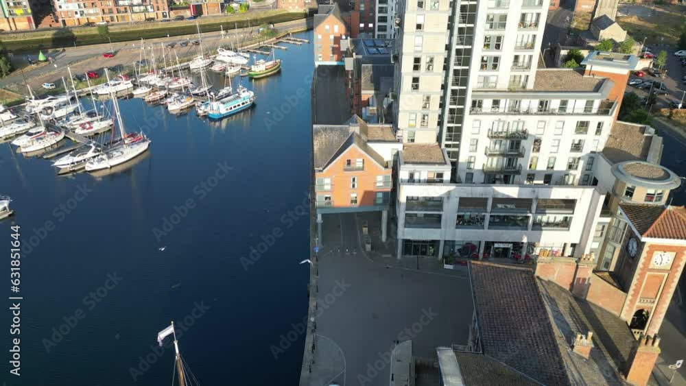 Drone view over residential buildings on a waterfront and boats parked on a port Drone view over residential buildings on a waterfront and boats parked on a port