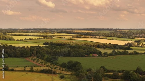 Wallpaper Mural Drone view over green rural fields under a cloudy sky Torontodigital.ca