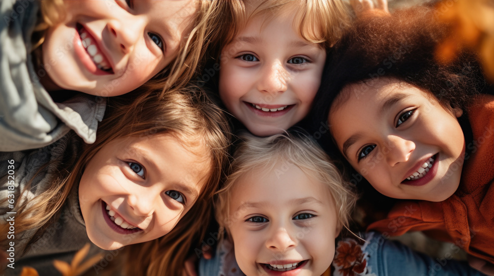 A group of happy schoolchildren gathered in a circle and look into the camera from below.Created with Generative AI technology. A group of happy schoolchildren gathered in a circle and look into the camera from below.Created with Generative AI technology.