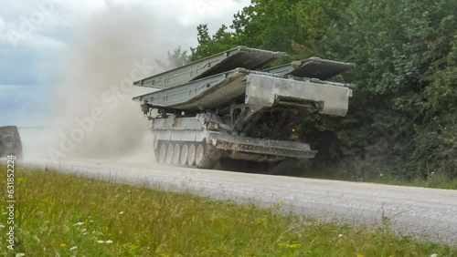 British army Challenger II 2 Titan Armoured Vehicle Launcher Bridge (AVLB) moving along a dirt track photo