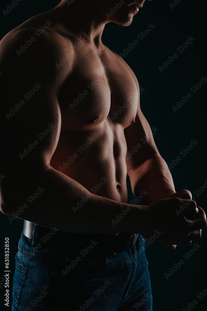 Good-looking and muscular man flexing his upper body