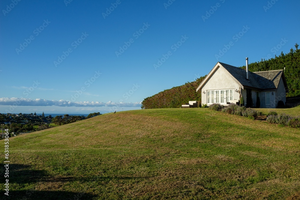 Charming, traditional-style single-family home on a hill in New Zealand.