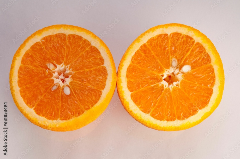 Closeup of oranges cut on a white background Closeup of oranges cut on a white background