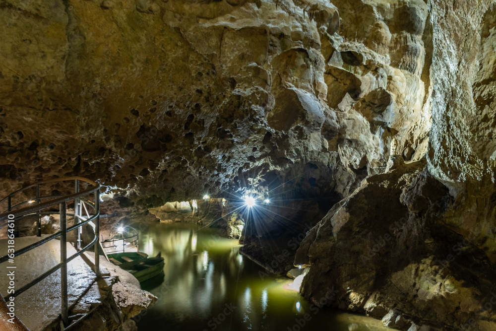open public area of underground cave network in Belgium Ardennes called Les Grottes de Remouchamps where tourists can explore the subterranean world with impressive geological rock formations 