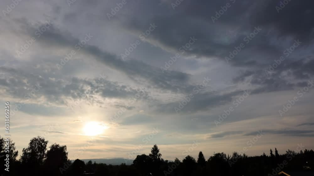 Timelapse scene of clouds moving on silhouette trees, for wallpaper Timelapse scene of clouds moving on silhouette trees, for wallpaper