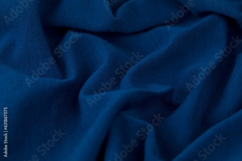 Close-up shot of a piece of light blue fabric with subtle highlights