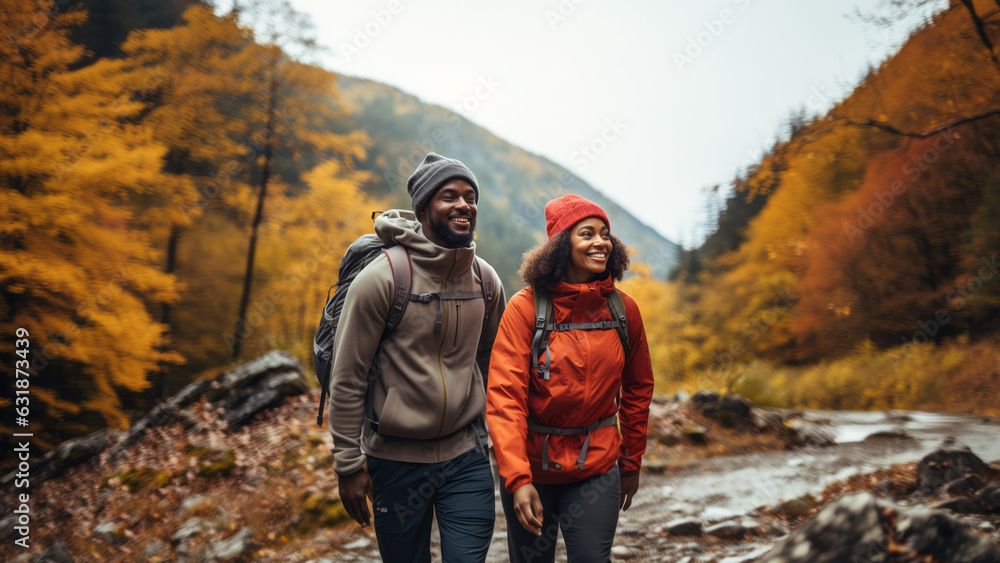 Young black couple hiking in the fall
