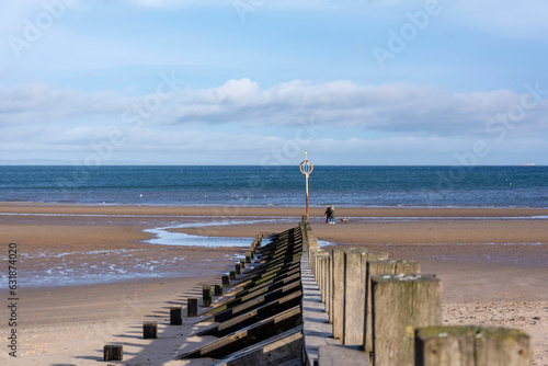 Cold winter walk on peaceful quiet empty Portobello Beach in Edinburgh, Scotland