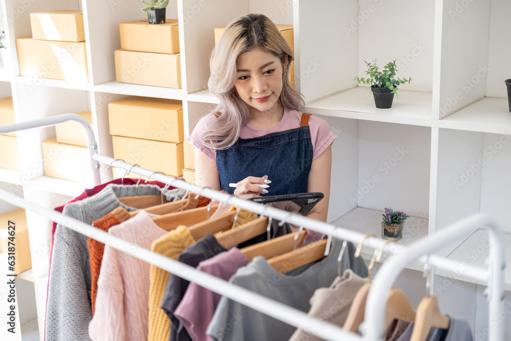 Young happy female woman lady fashion blogger business owner sale showing check clothes for present and sell in livestream live online internet shop Young happy female woman lady fashion blogger business owner sale showing check clothes for present and sell in livestream live online internet shop