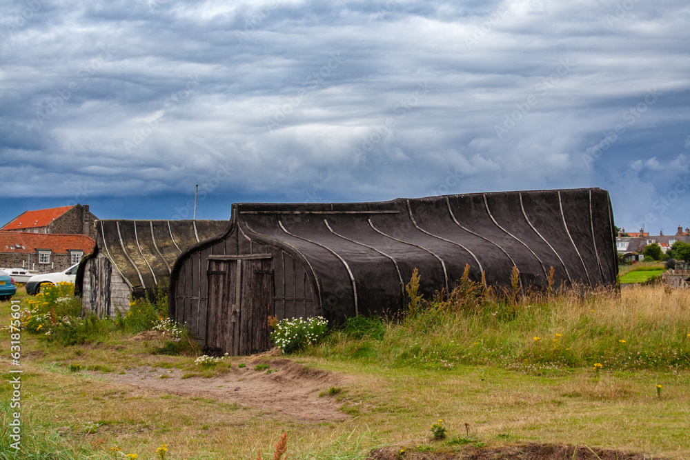 Upturned boats used as sheds on Lindisfarne Upturned boats used as sheds on Lindisfarne