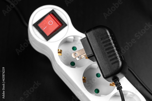 Failure to connect different incompatible American electrical plug and  European splitter socket photo