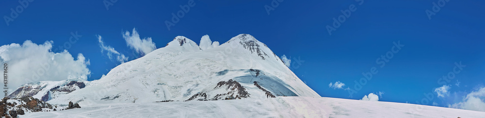 Panorama of a mountain range in the Caucasus mountains. Mount Elbrus.