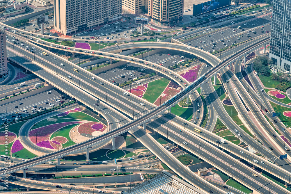 Dubai's bustling city center with multi-lane roads. Photographed from above of the Burj Khalifa.