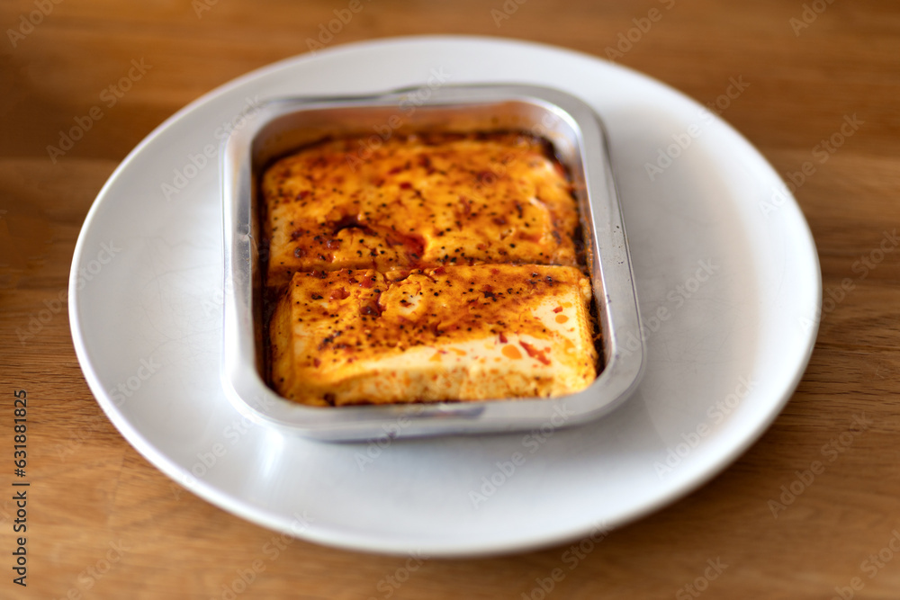 Baked cheese on the wood table Baked cheese on the wood table