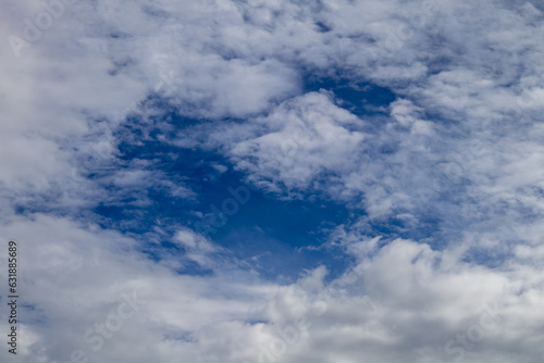 Fototapeta Naklejka Na Ścianę i Meble -  Blue clearing between white clouds
