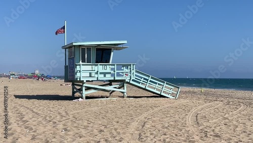 Lifeguard tower along a pacific coastline public beach with blue skies and copy space