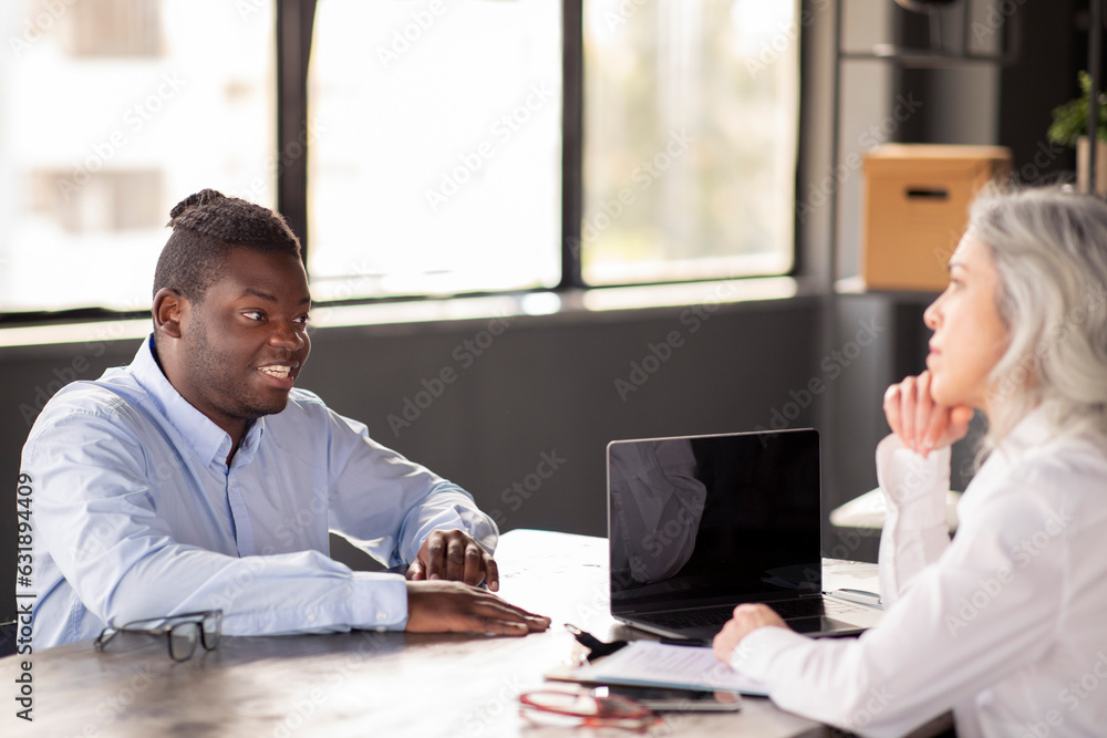 Black Man Having Job Interview Talking To HR Manager Indoor Black Man Having Job Interview Talking To HR Manager Indoor