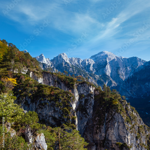 Sunny colorful autumn alpine scene. Peaceful rocky mountain view from hiking path near Almsee lake  Upper Austria.