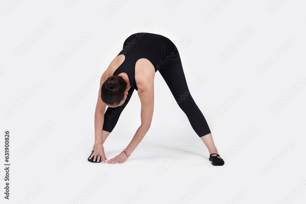 trauma releasing exercises, for elderly people, old woman in the studio isolated on white, exercising hamstring