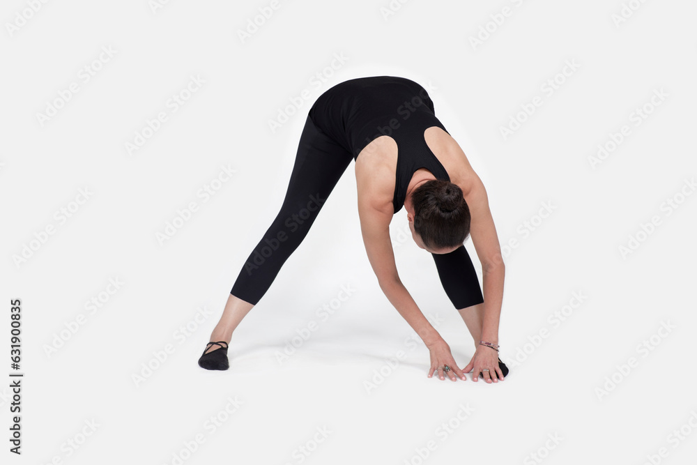 trauma releasing exercises, for elderly people, old woman in the studio isolated on white, exercising hamstring trauma releasing exercises, for elderly people, old woman in the studio isolated on white, exercising hamstring
