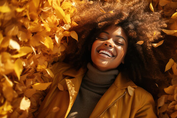 beautiful black woman smiling in autumn leaves, fashionable portrait in fall season, orange autumn tones