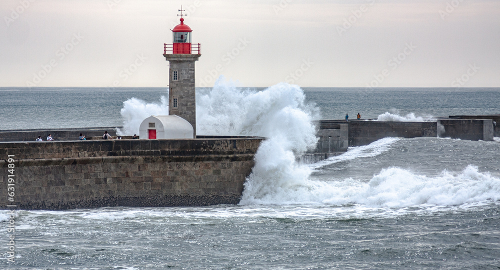 lighthouse with breaking waves