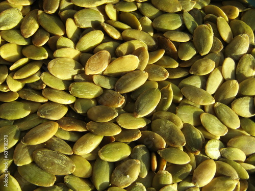 close up of green pumpkin seeds background